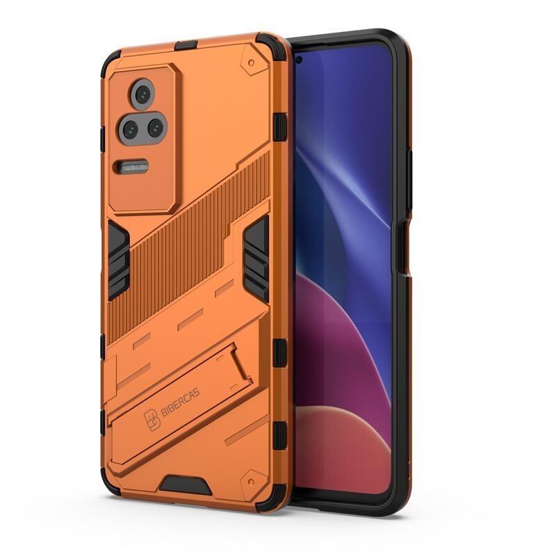 Héjálló hibrid borítás csuklós állvánnyal a Xiaomi Poco F4 5G-hez - narancssárga színű