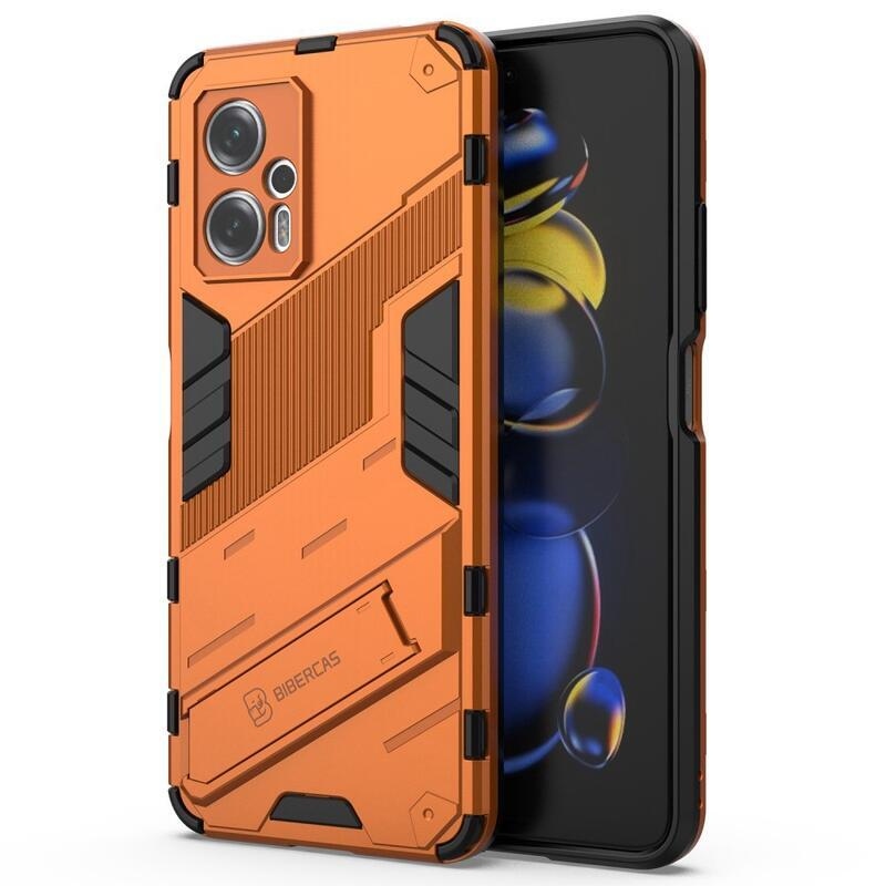 Héjálló hibrid borítás csuklós állvánnyal a Xiaomi Poco X4 GT 5G-hez - narancssárga