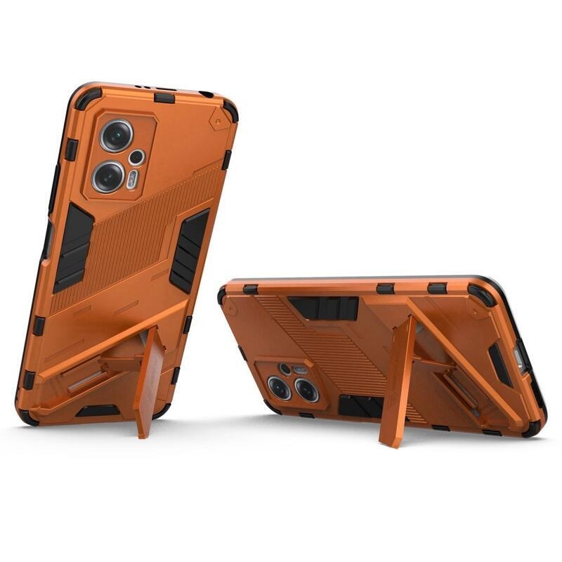 Héjálló hibrid borítás csuklós állvánnyal a Xiaomi Poco X4 GT 5G-hez - narancssárga