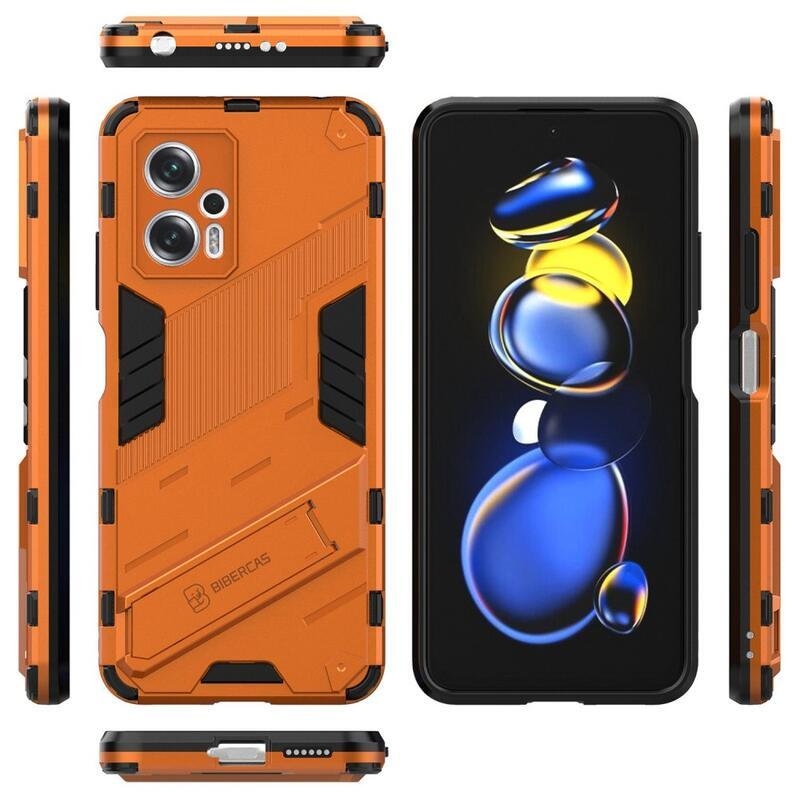 Héjálló hibrid borítás csuklós állvánnyal a Xiaomi Poco X4 GT 5G-hez - narancssárga