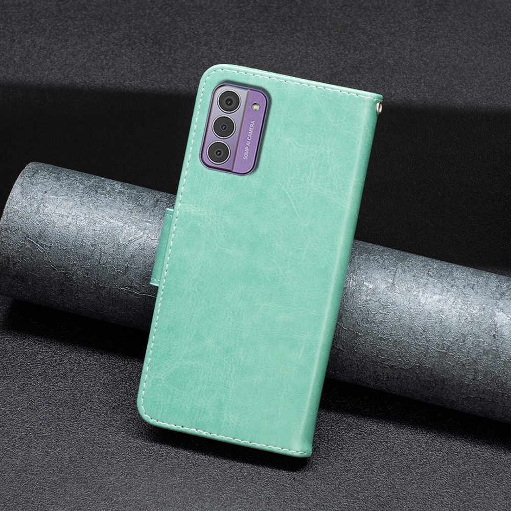 Pillangó könyvtáska Nokia G42-hez - teal színű