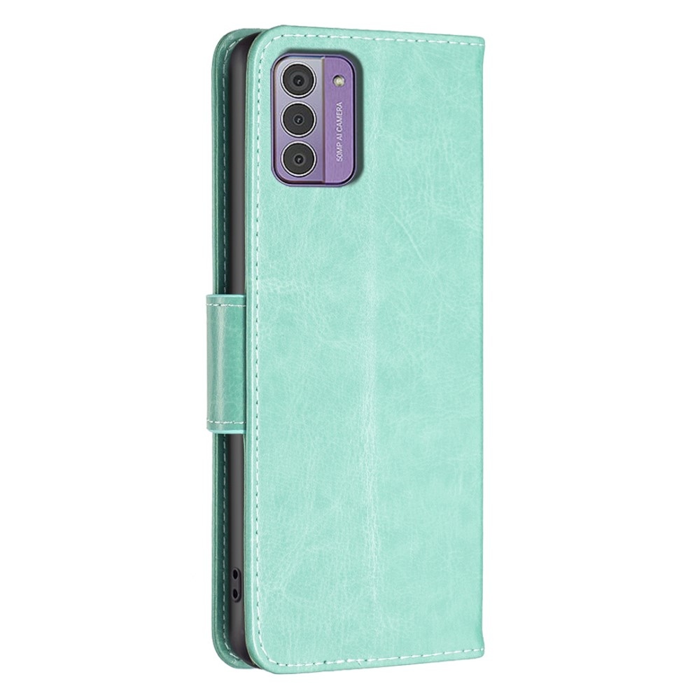 Pillangó könyvtáska Nokia G42-hez - teal színű